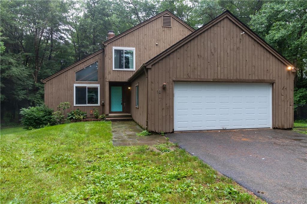 18 Smokey Ridge Road Simsbury, CT 06070 - Photo 1 of 1 a view of backyard of house with green space