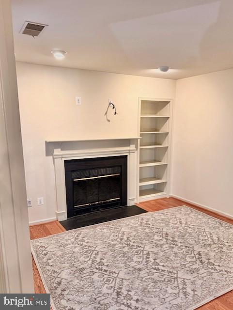 10714 Kings Riding Way, Unit 10121 Rockville, MD 20852 - Photo 7 of 24 Den with fireplace and built-in shelves