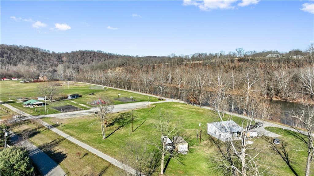 429 River Road Perryopolis, PA 15473 - Photo 5 of 14 a view of a lake with a mountain in the background