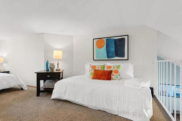 a bedroom with a bed and a table in it