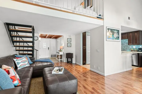 a living room with furniture fireplace and flat screen tv