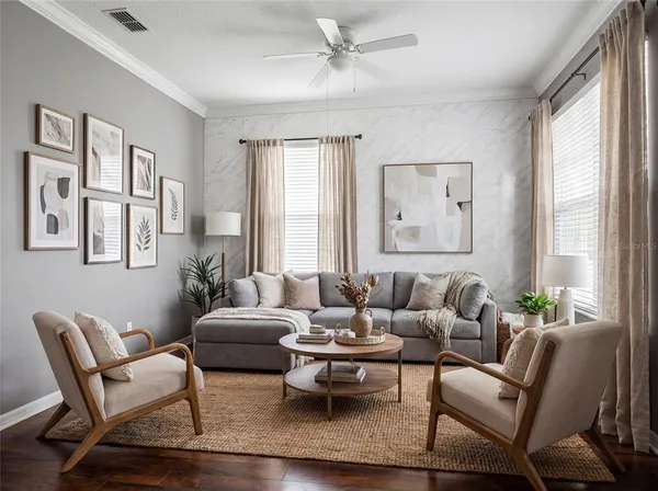 a living room with furniture and a large window