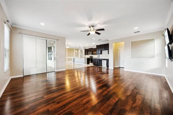 a view of kitchen with furniture and wooden floor
