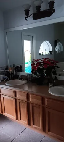 a bedroom with a bed and a table