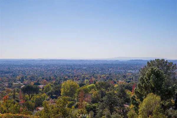 an aerial view of residential house and green space
