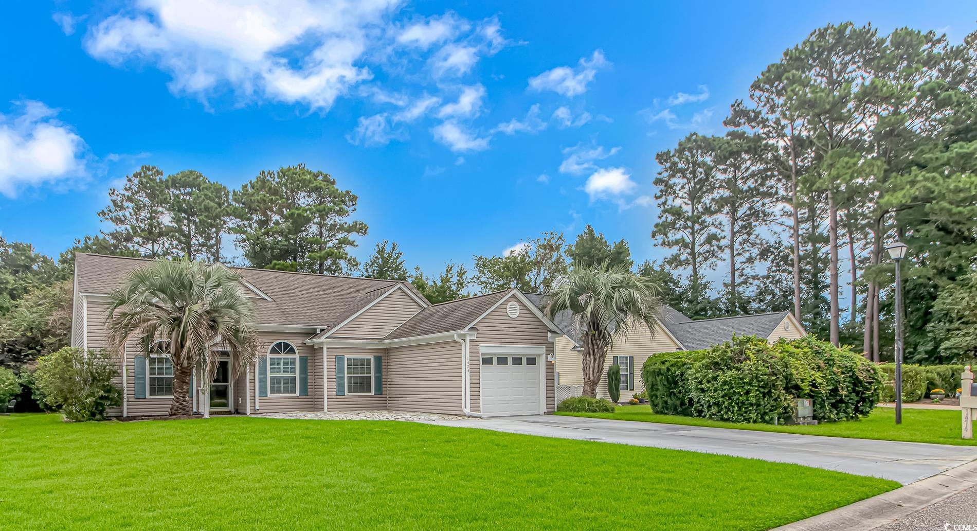 1474 Riceland Court Murrells Inlet, SC 29576 - Photo 1 of 30 Ranch-style house with a garage and a front lawn