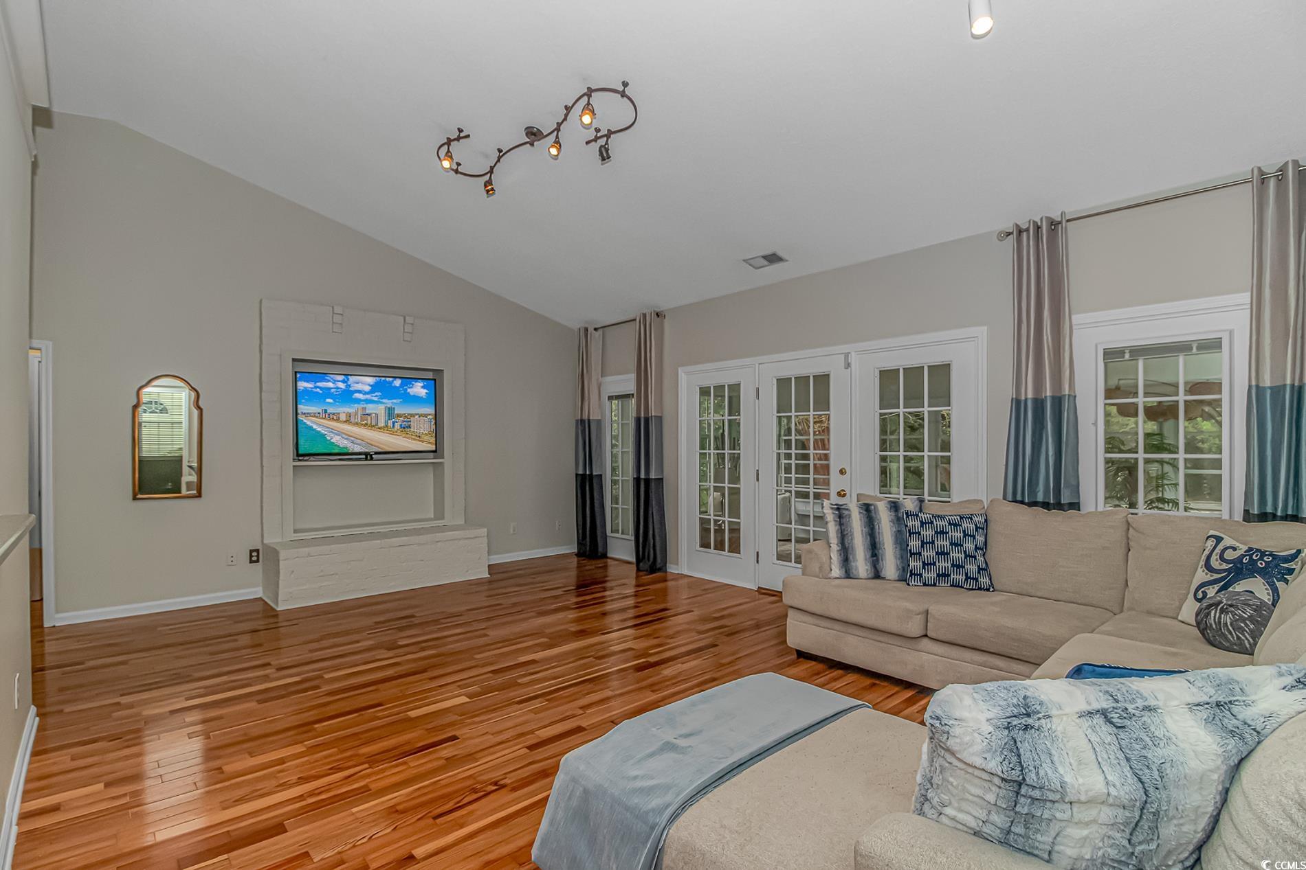 1474 Riceland Court Murrells Inlet, SC 29576 - Photo 11 of 30 Living room with vaulted ceiling, light hardwood /