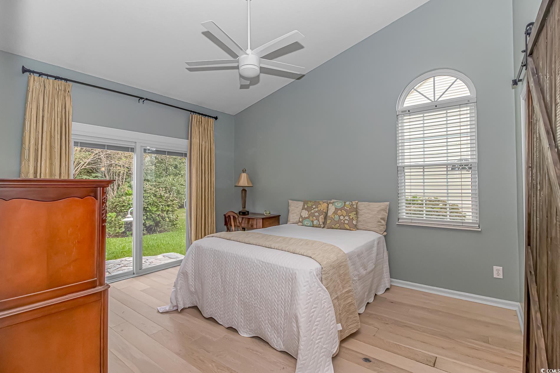 1474 Riceland Court Murrells Inlet, SC 29576 - Photo 13 of 30 Bedroom featuring light wood-type flooring, vaulte