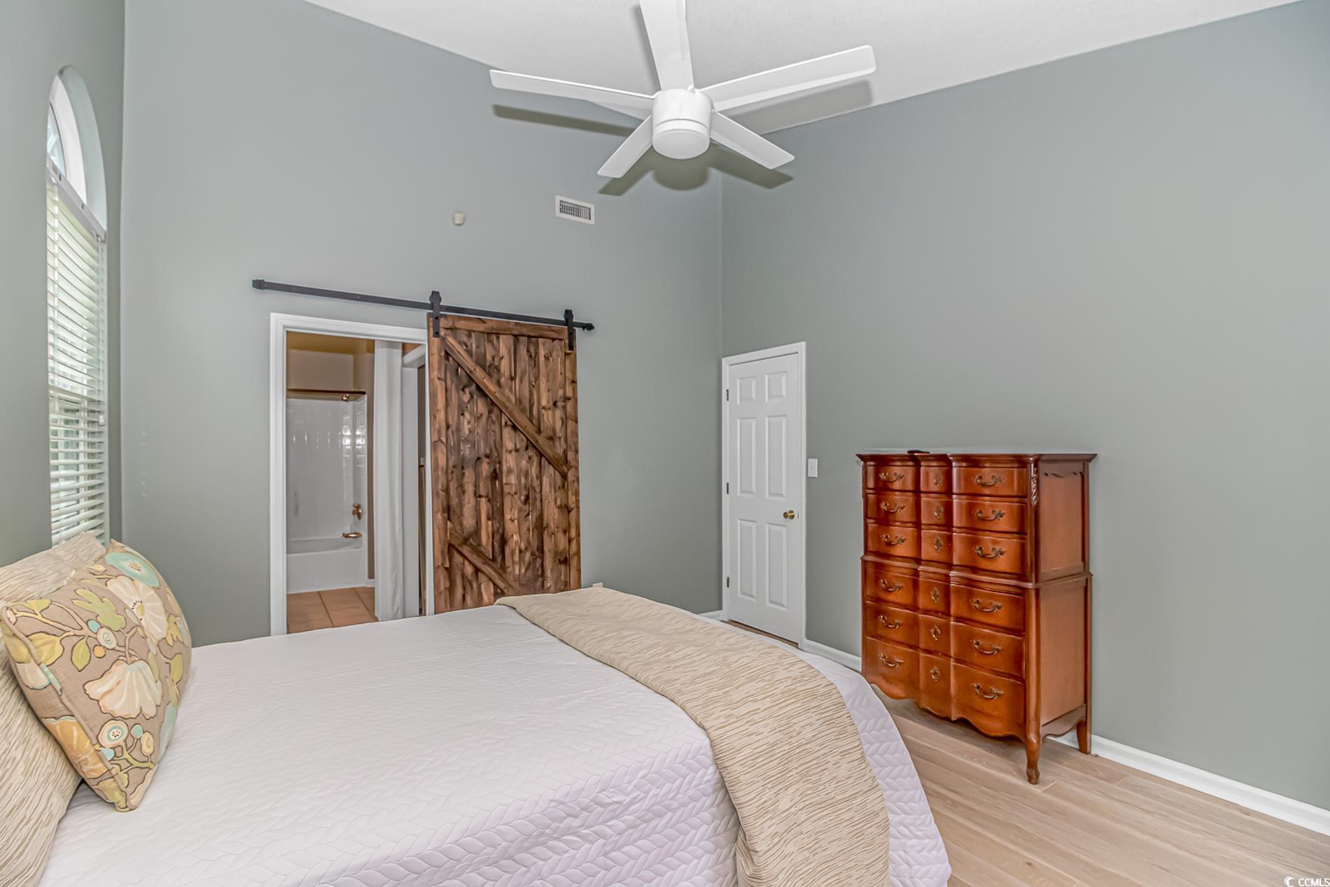 1474 Riceland Court Murrells Inlet, SC 29576 - Photo 14 of 30 Bedroom featuring ceiling fan, a high ceiling, lig
