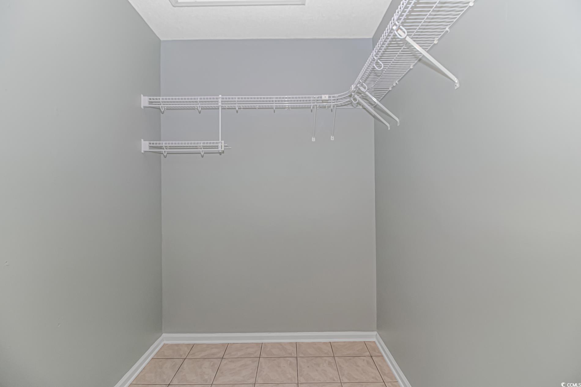 1474 Riceland Court Murrells Inlet, SC 29576 - Photo 15 of 30 Walk in closet with light tile patterned floors