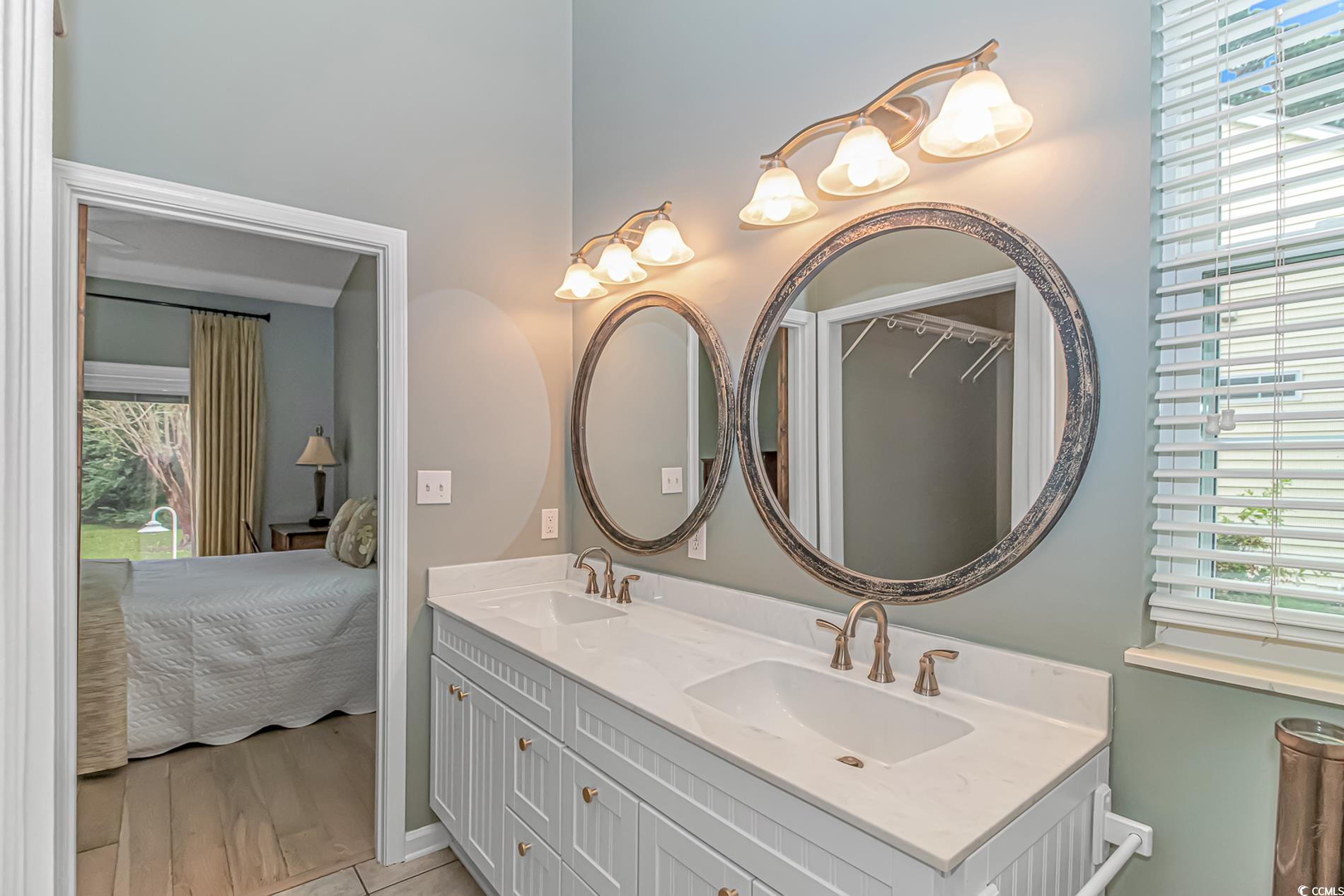 1474 Riceland Court Murrells Inlet, SC 29576 - Photo 17 of 30 Bathroom with vanity, hardwood / wood-style floori