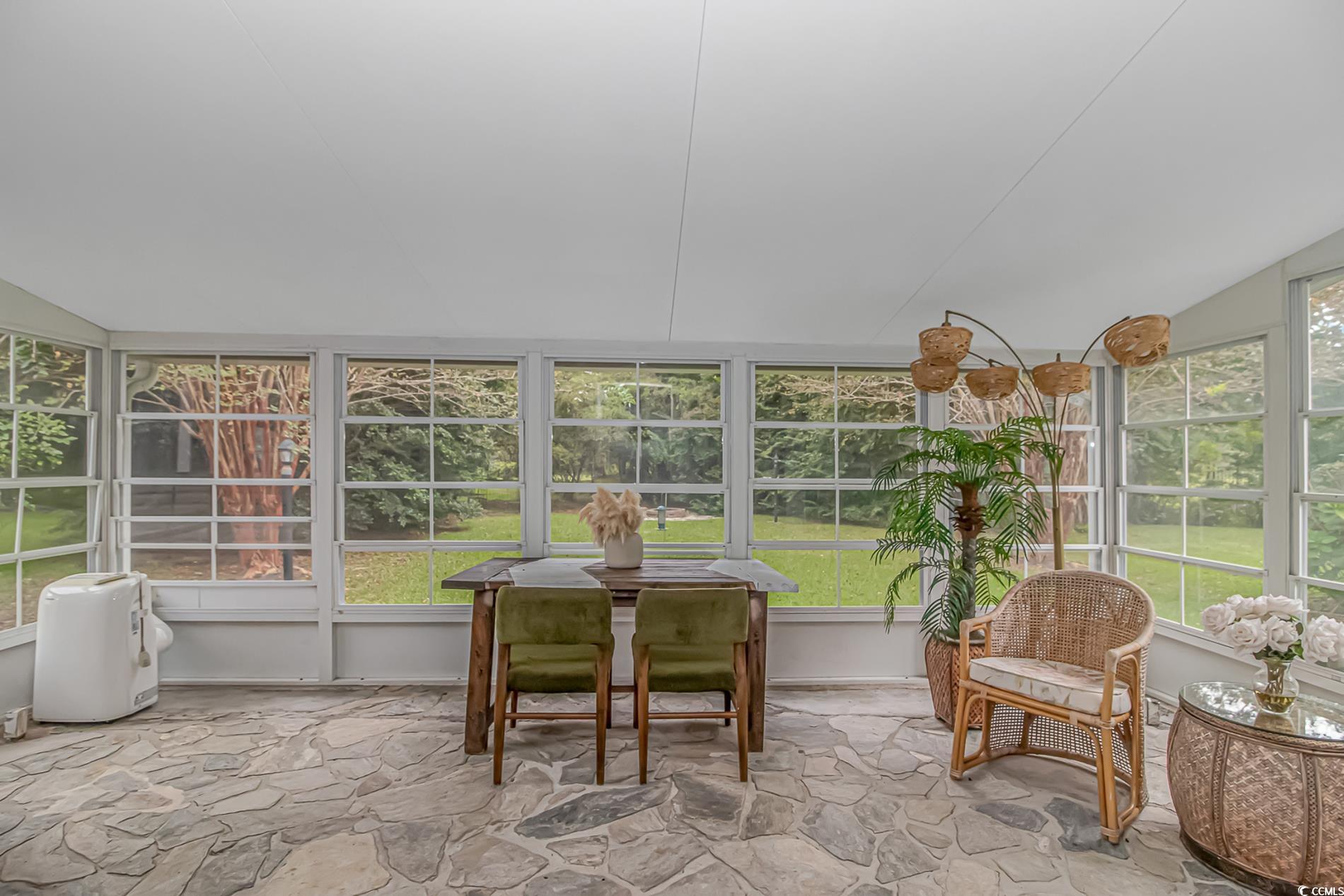 1474 Riceland Court Murrells Inlet, SC 29576 - Photo 22 of 30 Sunroom featuring a healthy amount of sunlight