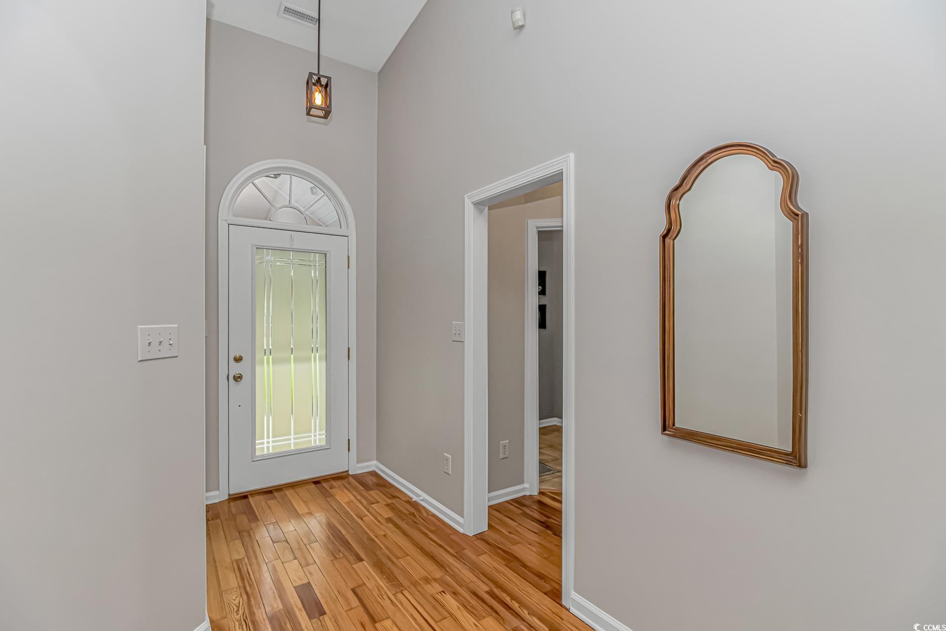 1474 Riceland Court Murrells Inlet, SC 29576 - Photo 4 of 30 Entrance foyer featuring a towering ceiling and li