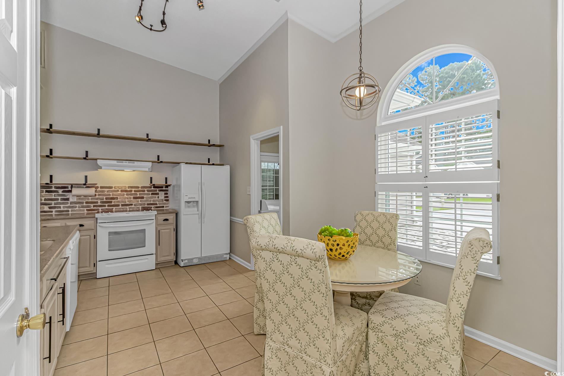 1474 Riceland Court Murrells Inlet, SC 29576 - Photo 5 of 30 Kitchen with white cabinetry, white appliances, ex