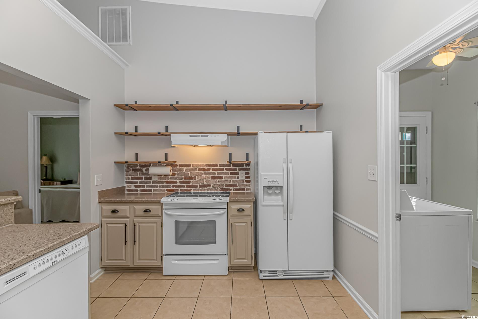 1474 Riceland Court Murrells Inlet, SC 29576 - Photo 6 of 30 Kitchen with light tile patterned flooring, tastef