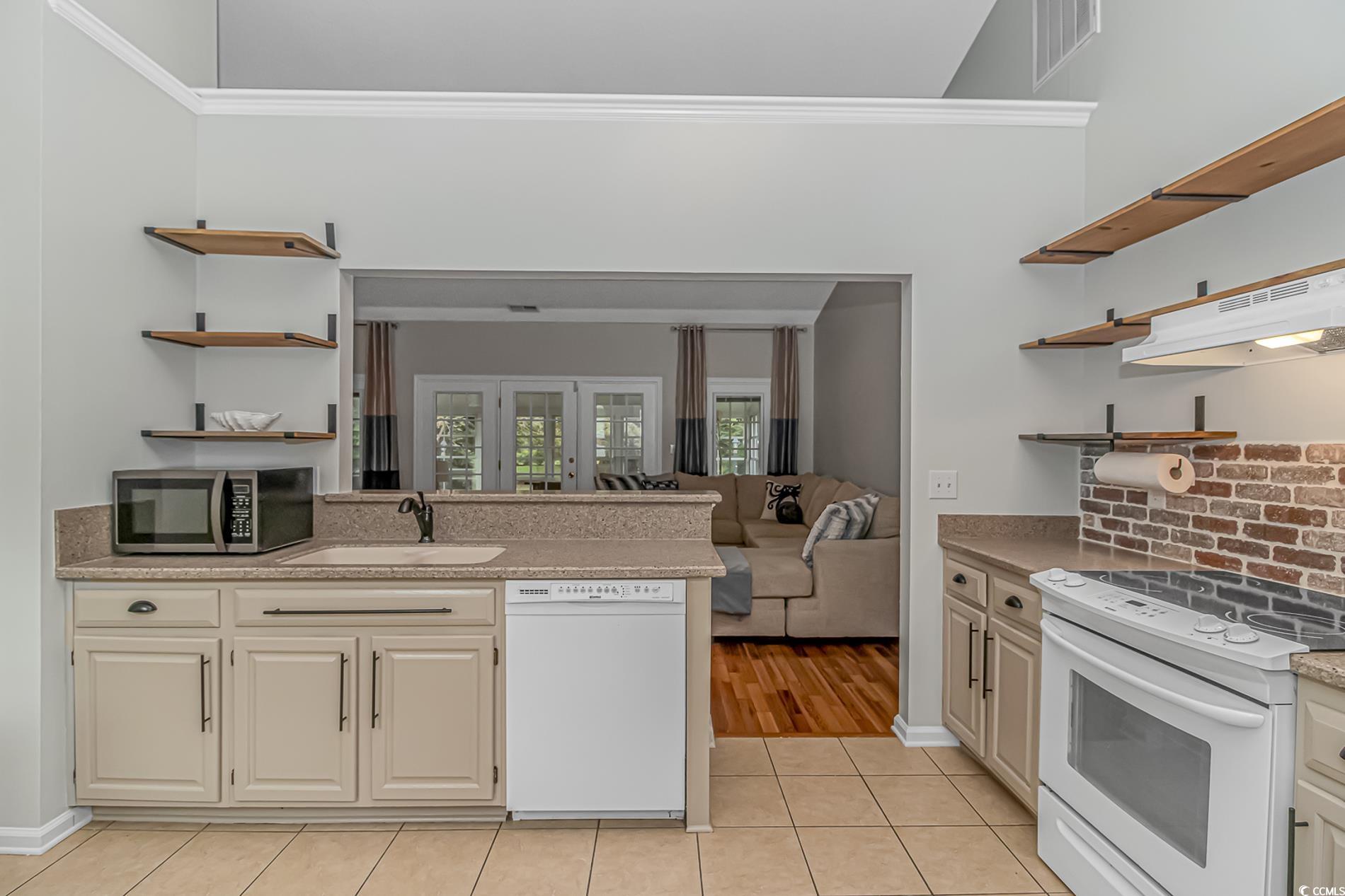 1474 Riceland Court Murrells Inlet, SC 29576 - Photo 8 of 30 Kitchen with tasteful backsplash, white appliances