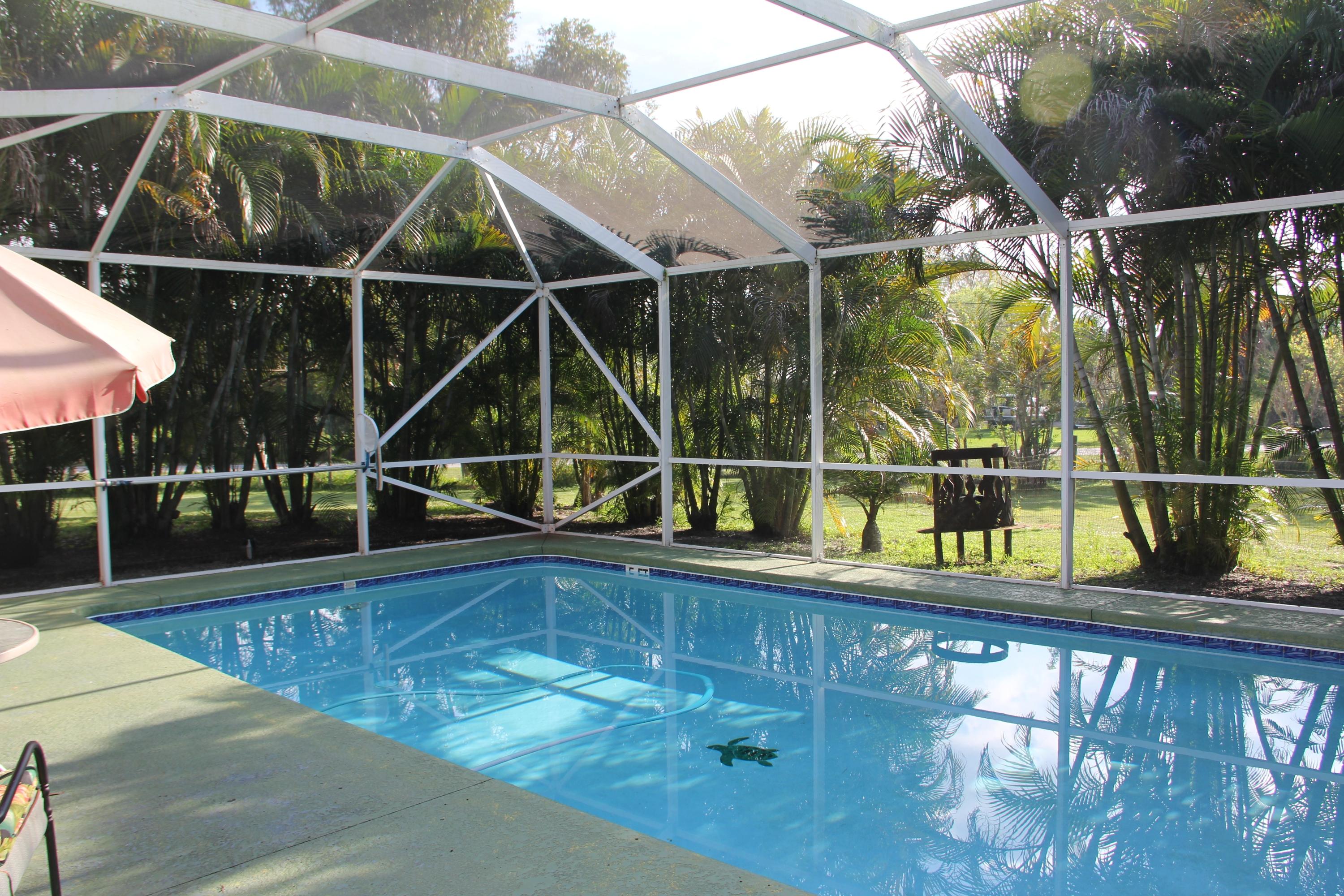 9141 154th Road North Jupiter, FL 33478 - Photo 34 of 61 Screened Pool & Patio
