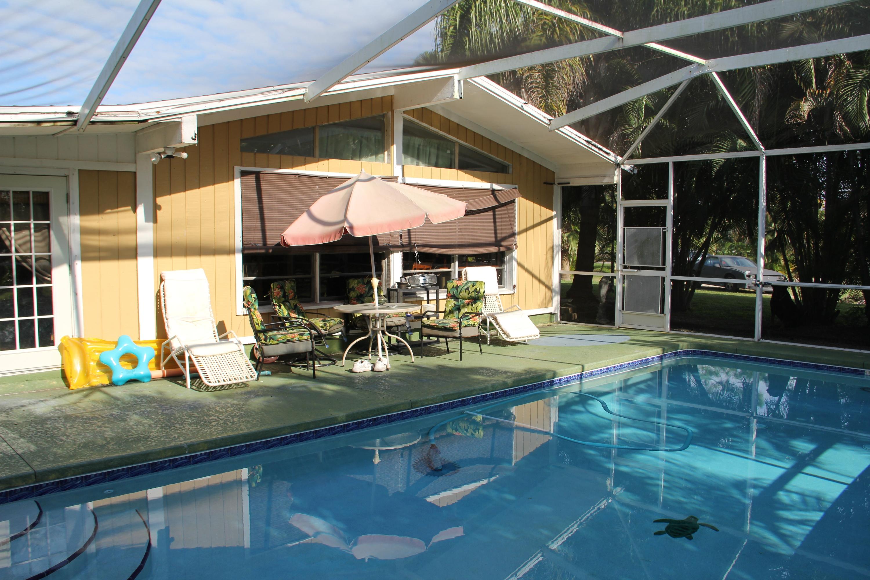 9141 154th Road North Jupiter, FL 33478 - Photo 36 of 61 Screened Pool & Patio