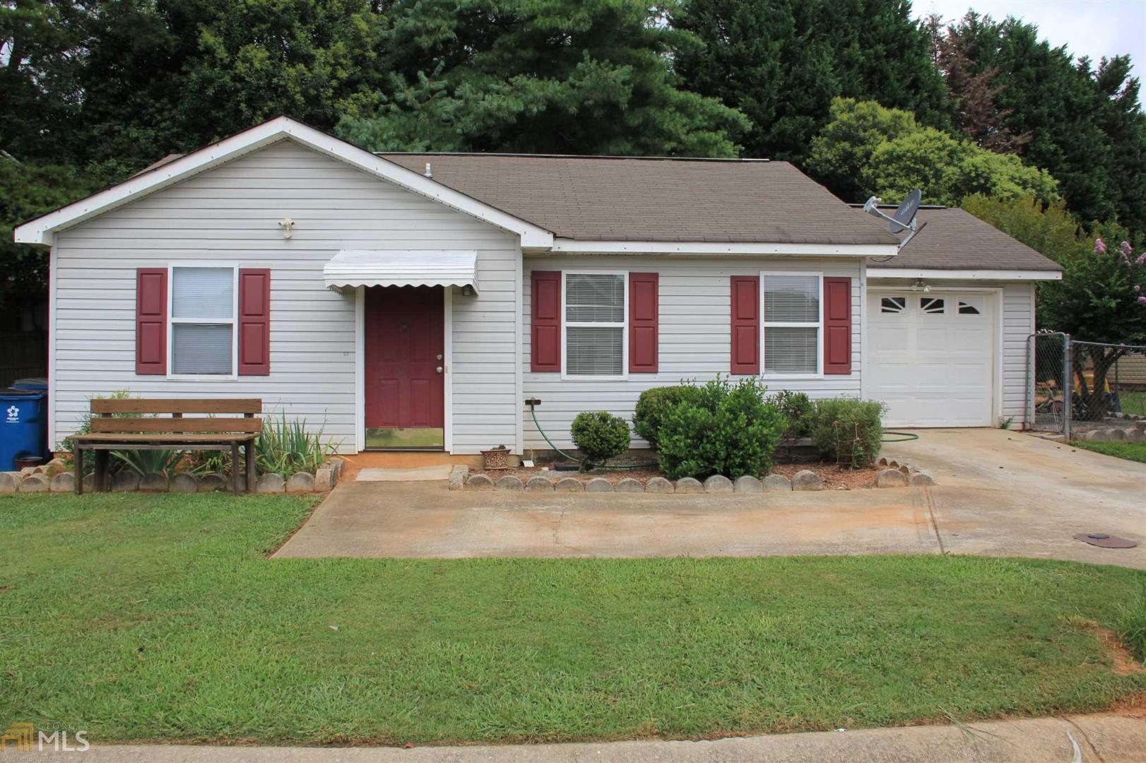 111 North Ridge Drive Athens, GA 30607 - Photo 1 of 1 a front view of a house with a yard and garage