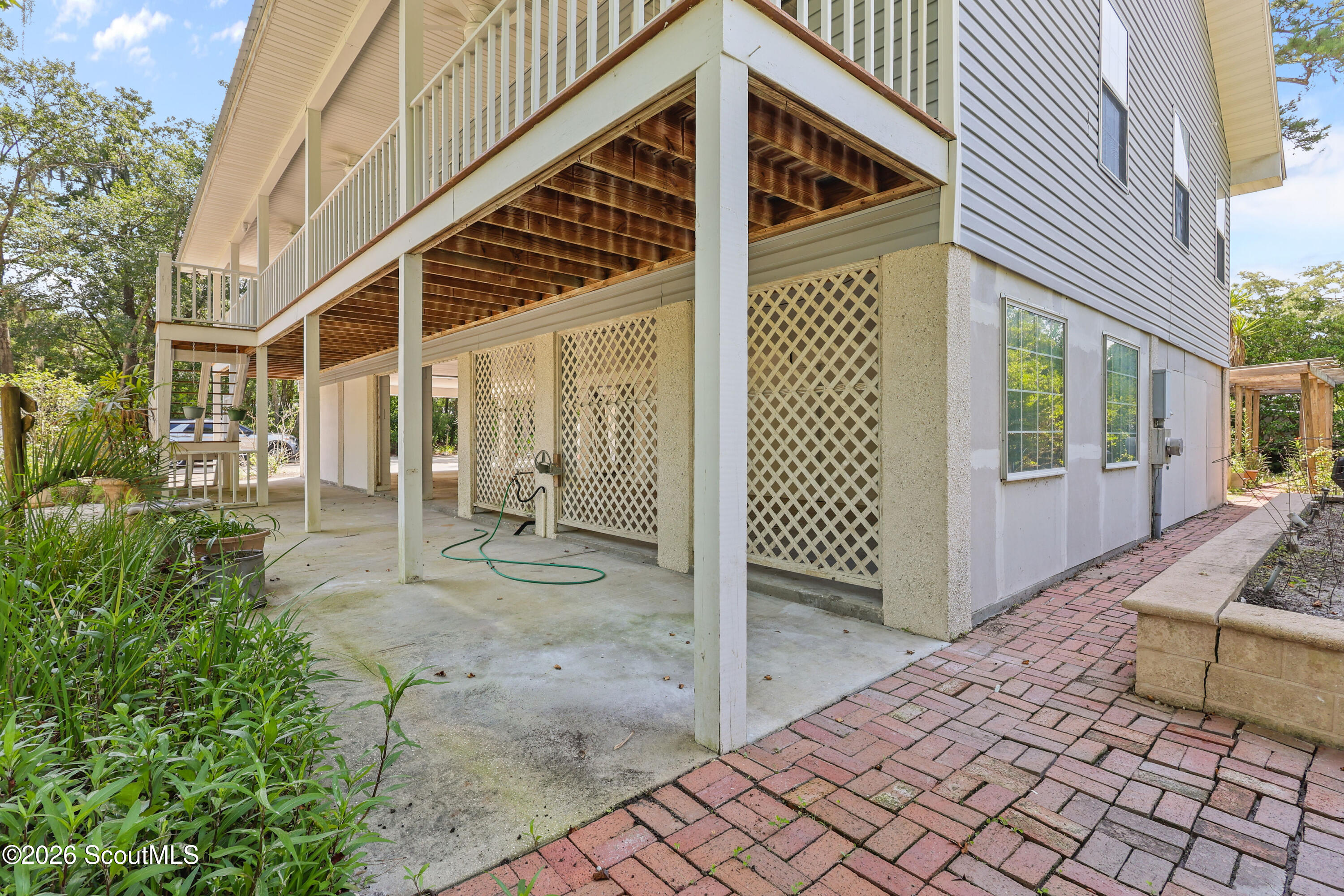 104 Sapelo Street St. Simons Island, GA 31522 - Photo 11 of 45 Brick walk ways leading to garden and compost area