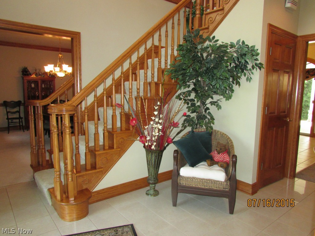 4645 Rock Spring Road Ravenna, OH 44266 - Photo 10 of 25 Two-story foyer. Turn right to the living room. Left to the dining room. Straight ahead to the large kitchen!