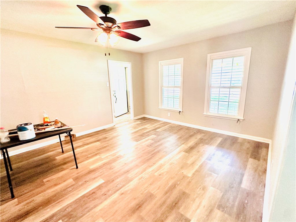 1202 Devon Drive Corpus Christi, TX 78404 - Photo 13 of 19 a view of a room with a window and wooden floor