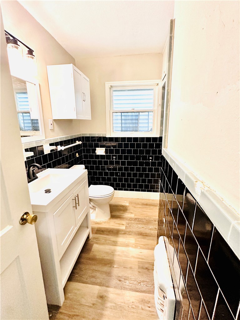 1202 Devon Drive Corpus Christi, TX 78404 - Photo 7 of 19 a view of a bathroom with a sink and a window