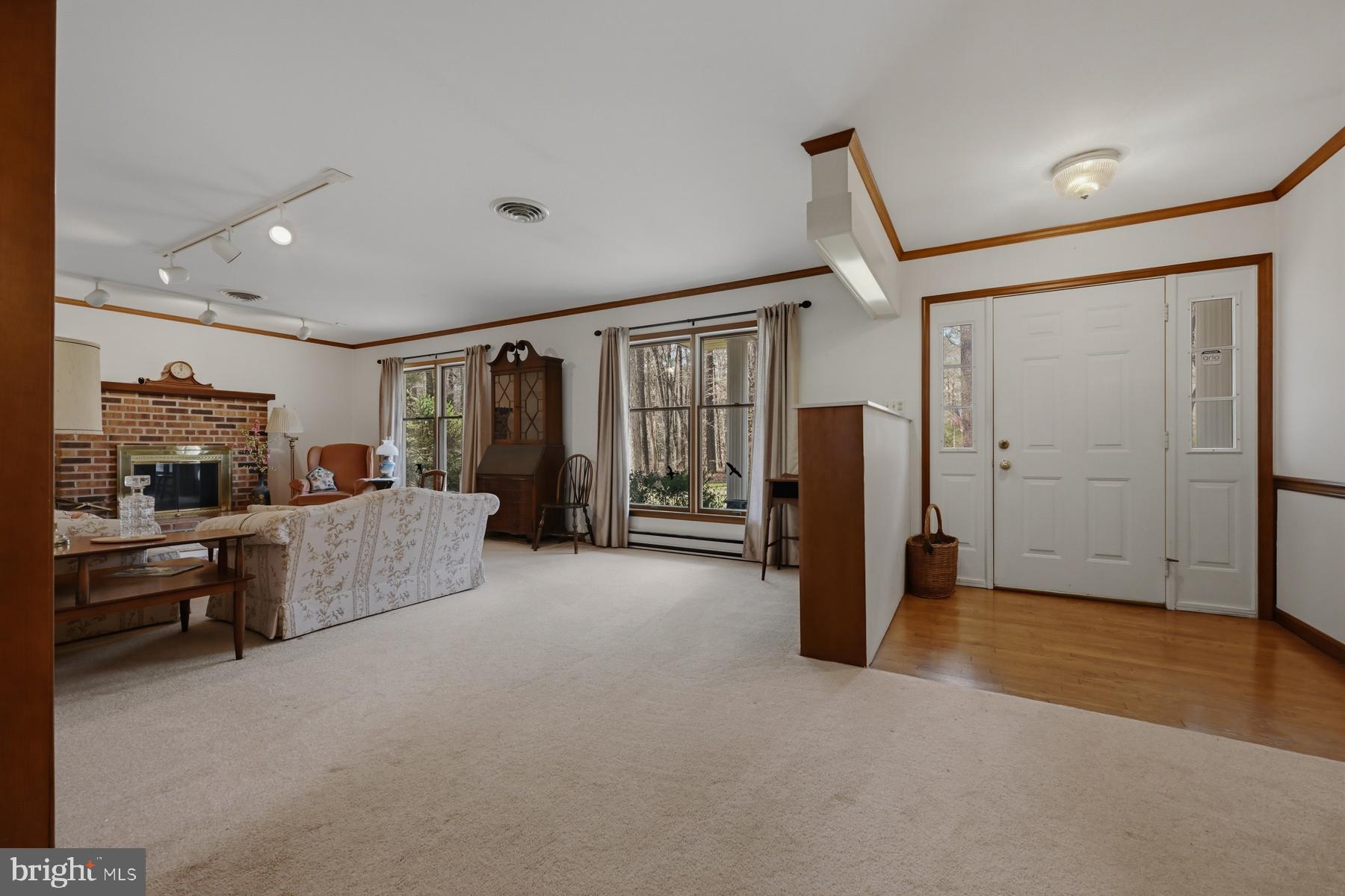 9829 Bantry Road Easton, MD 21601 - Photo 16 of 65 a living room with furniture and a flat screen tv