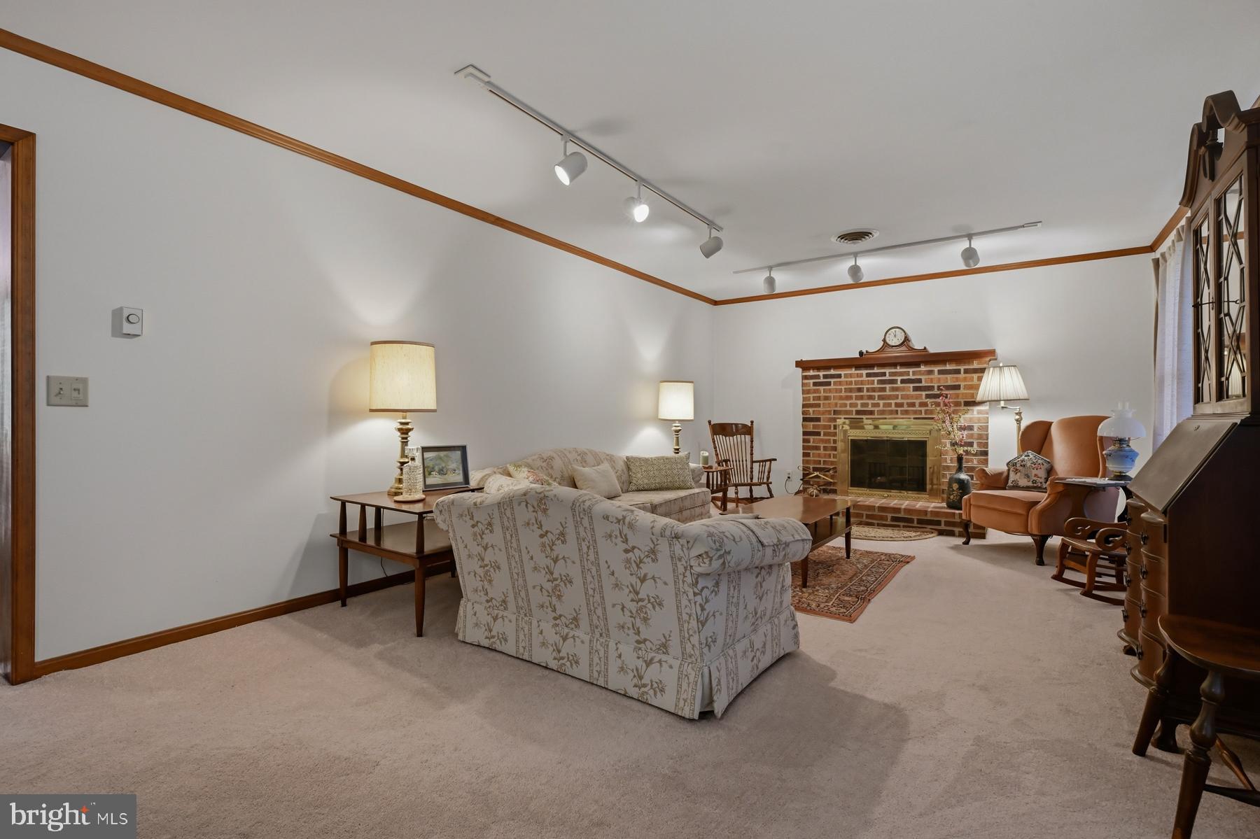 9829 Bantry Road Easton, MD 21601 - Photo 17 of 65 a living room with furniture and a fireplace