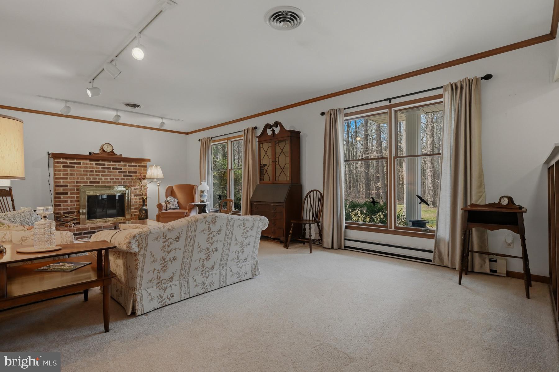 9829 Bantry Road Easton, MD 21601 - Photo 18 of 65 a living room with furniture and a fireplace