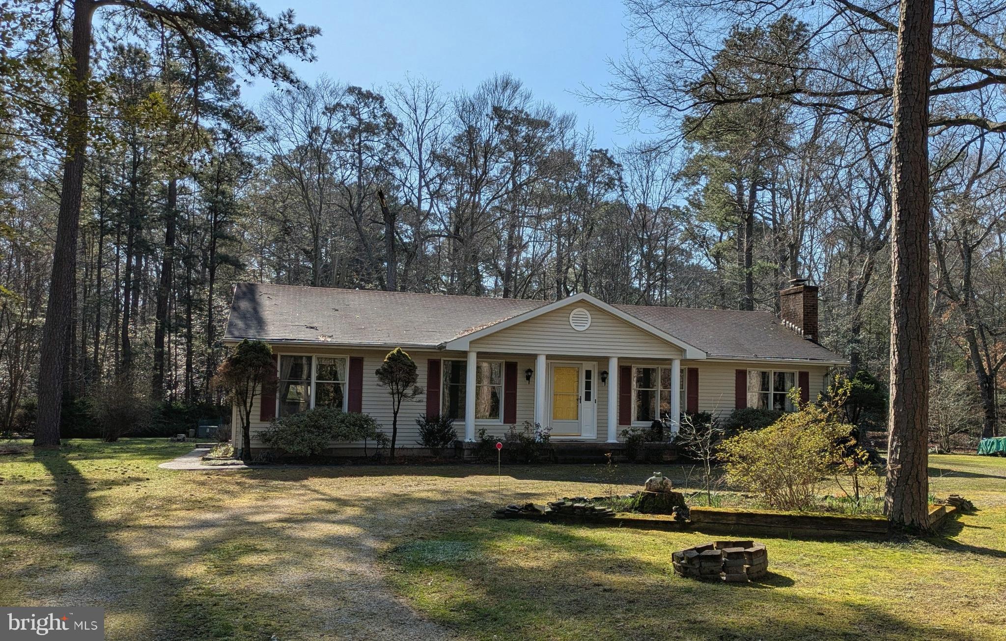 9829 Bantry Road Easton, MD 21601 - Photo 2 of 65 a front view of a house with a garden