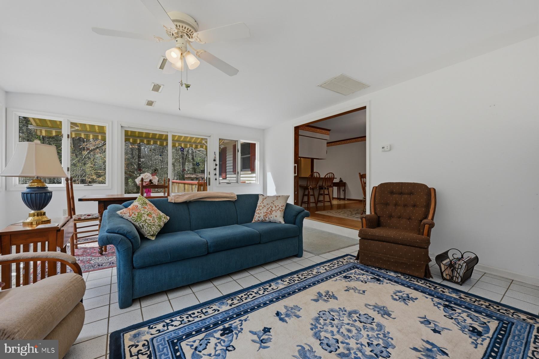 9829 Bantry Road Easton, MD 21601 - Photo 29 of 65 a living room with furniture ceiling fan and a rug