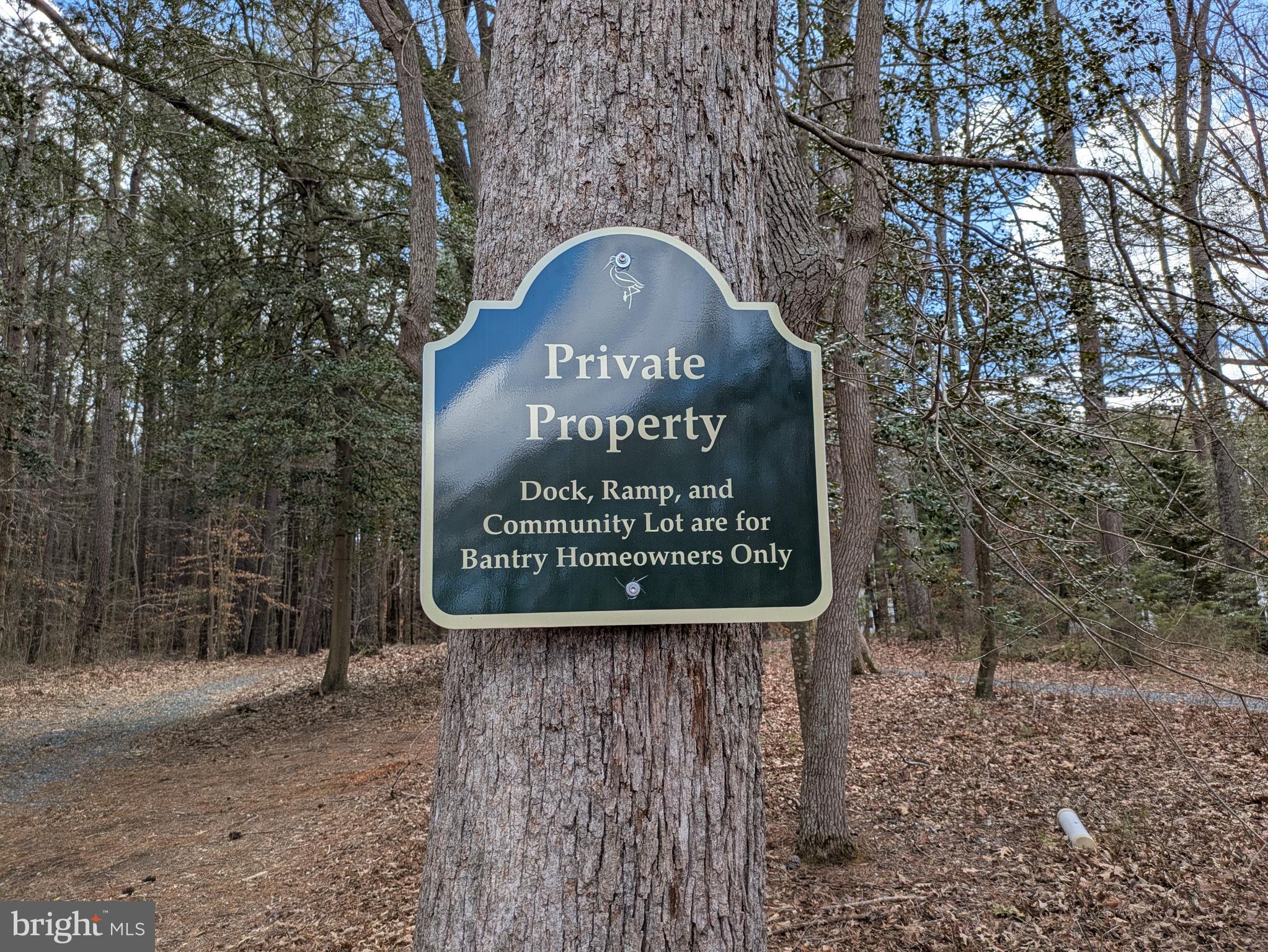 9829 Bantry Road Easton, MD 21601 - Photo 48 of 65 a sign that is sitting on a brick wall