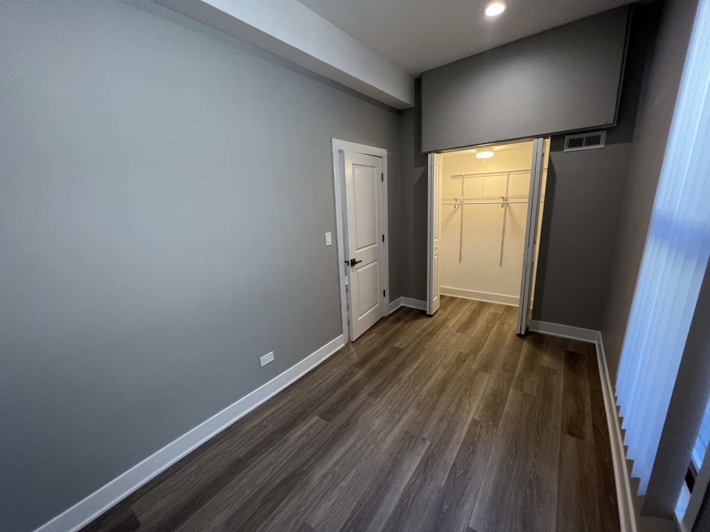 1227 West Ohio Street, Unit 3 Chicago, IL 60642 - Photo 12 of 18 a view of wooden floor and brick walls