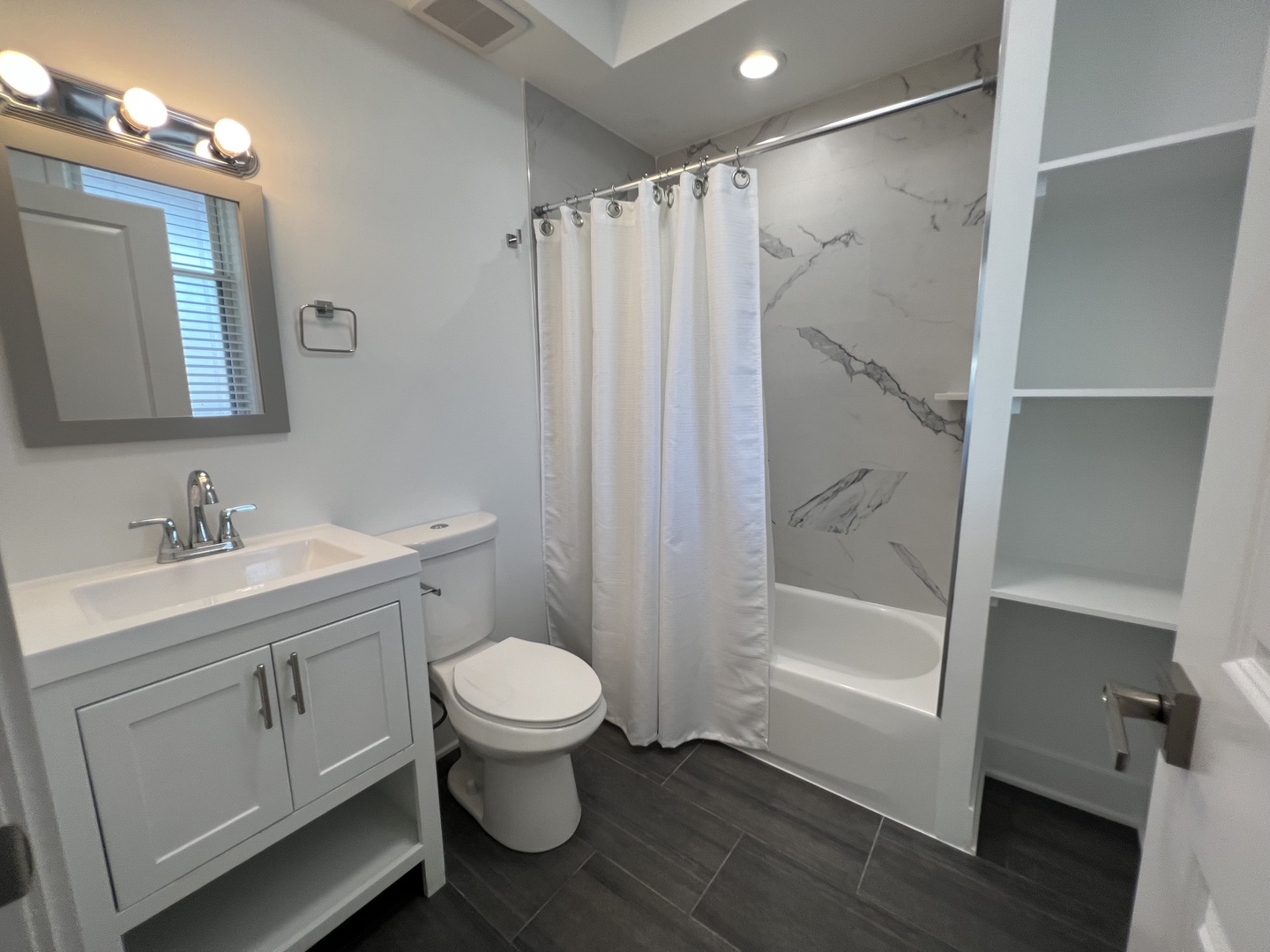1227 West Ohio Street, Unit 3 Chicago, IL 60642 - Photo 13 of 18 a bathroom with a sink toilet and shower