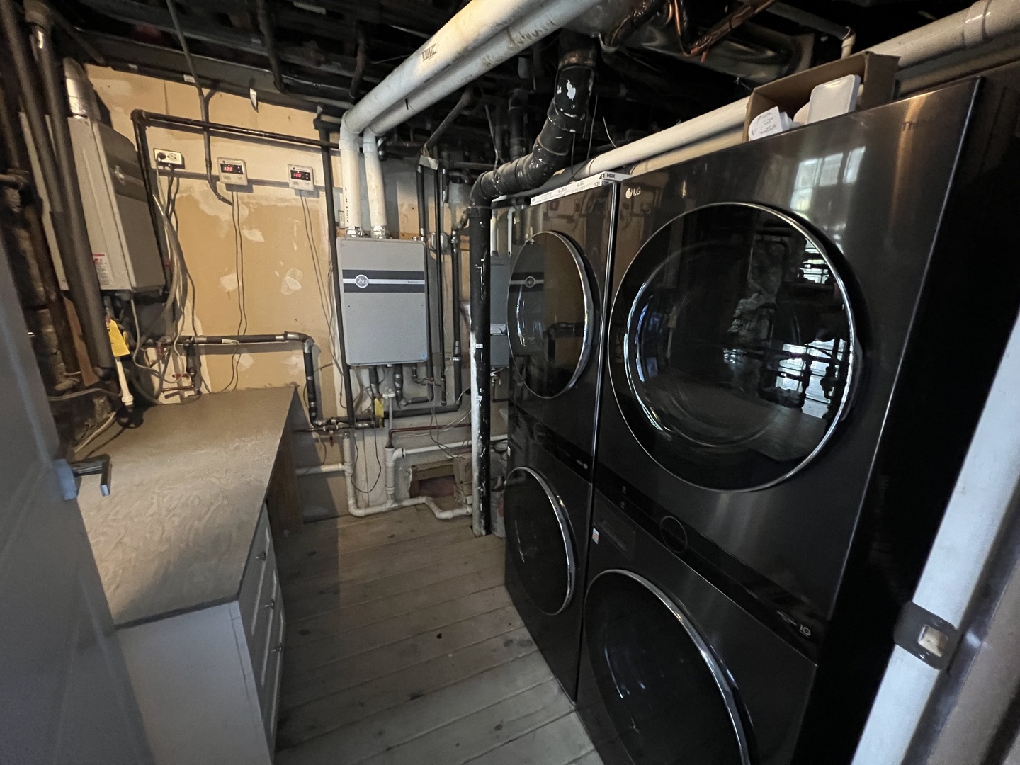 1227 West Ohio Street, Unit 3 Chicago, IL 60642 - Photo 16 of 18 a utility room with dryer and washer