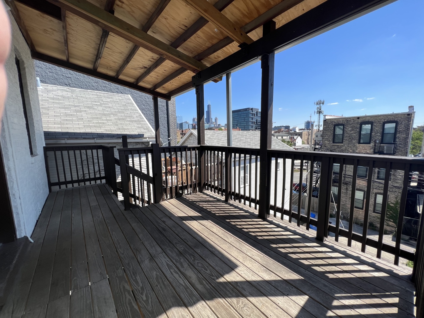 1227 West Ohio Street, Unit 3 Chicago, IL 60642 - Photo 9 of 18 a view of a balcony with wooden floor