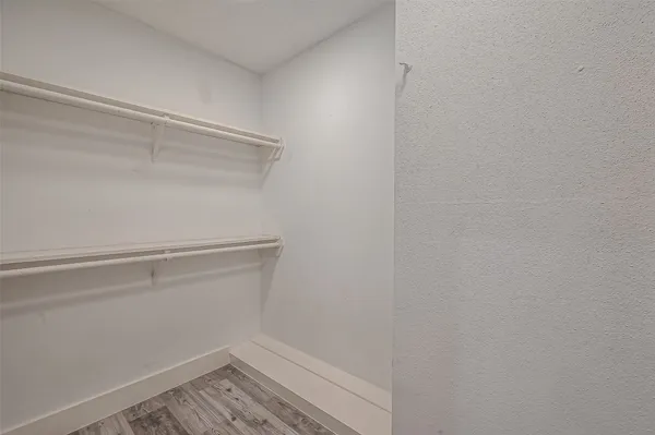 a view of an empty walk in closet