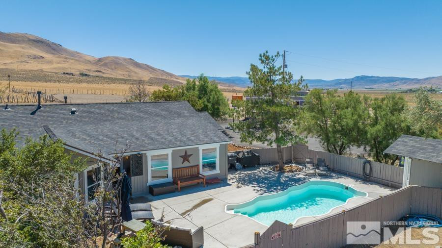 5940 Grass Valley Road Reno, NV 89510 - Photo 22 of 39 aerial view of house with yard and outdoor seating