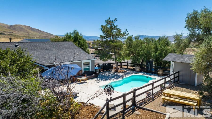 5940 Grass Valley Road Reno, NV 89510 - Photo 32 of 39 a view of backyard with outdoor seating and green space