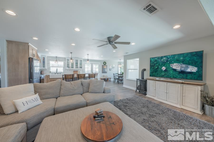 5940 Grass Valley Road Reno, NV 89510 - Photo 8 of 39 a living room with furniture and a flat screen tv