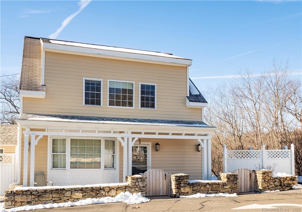 107 Black Rock Turnpike, Unit C Redding, CT 06896 - Photo 1 of 15 a front view of a house with a parking space