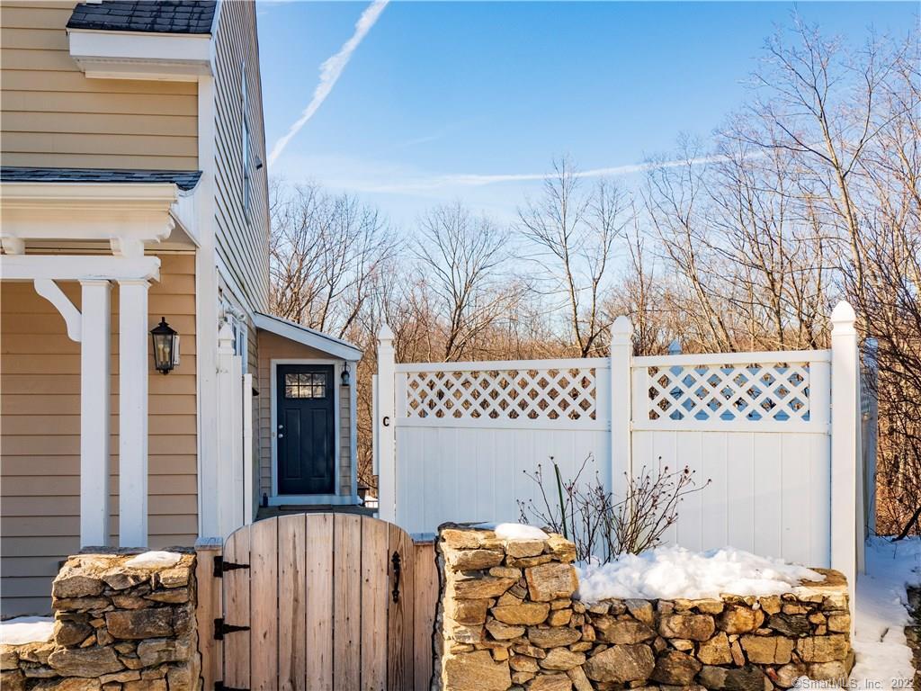 107 Black Rock Turnpike, Unit C Redding, CT 06896 - Photo 3 of 15 a bedroom with a bed and a couch
