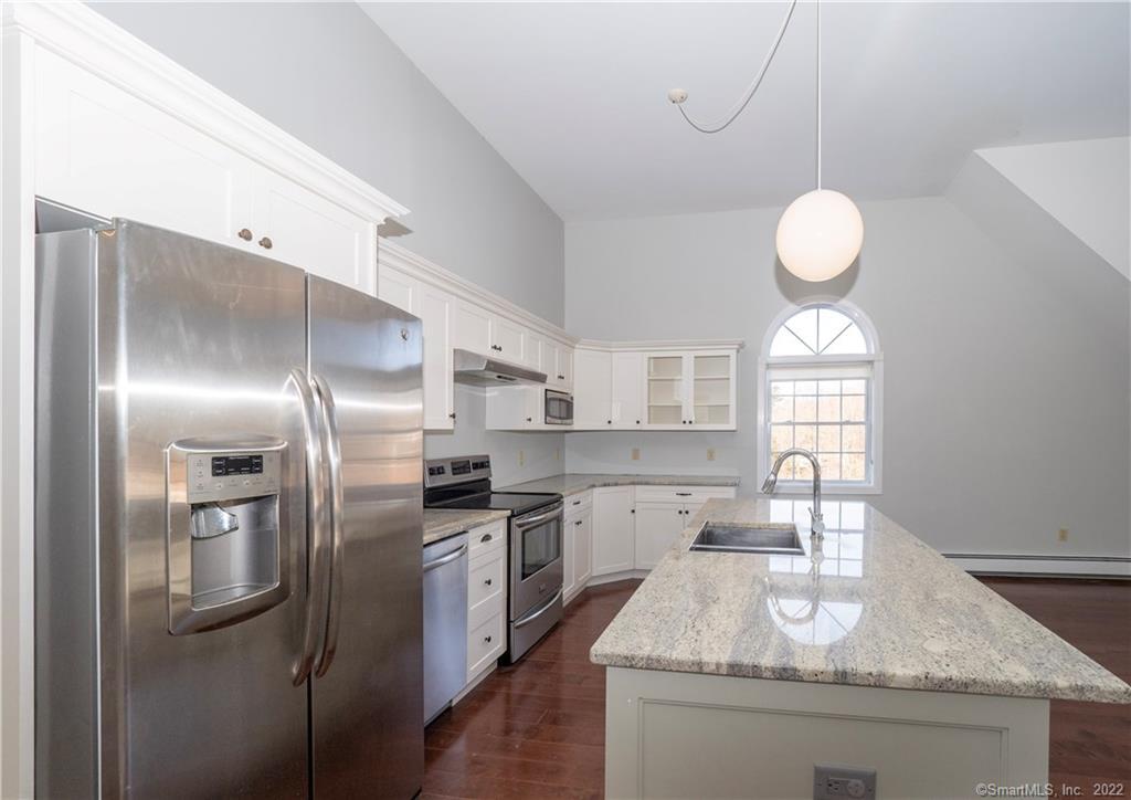 107 Black Rock Turnpike, Unit C Redding, CT 06896 - Photo 6 of 15 a kitchen with stainless steel appliances granite countertop a sink a stove and a refrigerator