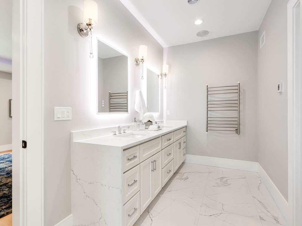 8 Manson Road Needham, MA 02494 - Photo 26 of 36 a bathroom with a sink a mirror and a bathtub