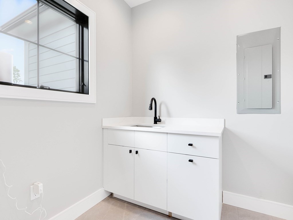 8 Manson Road Needham, MA 02494 - Photo 30 of 36 a bathroom with a sink and mirror