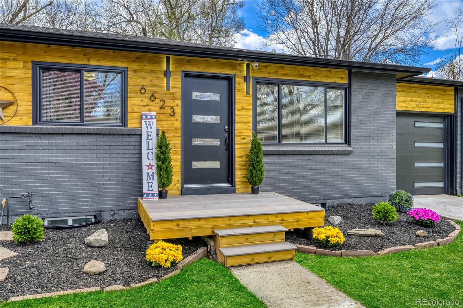 a front view of house with yard swimming pool and outdoor seating