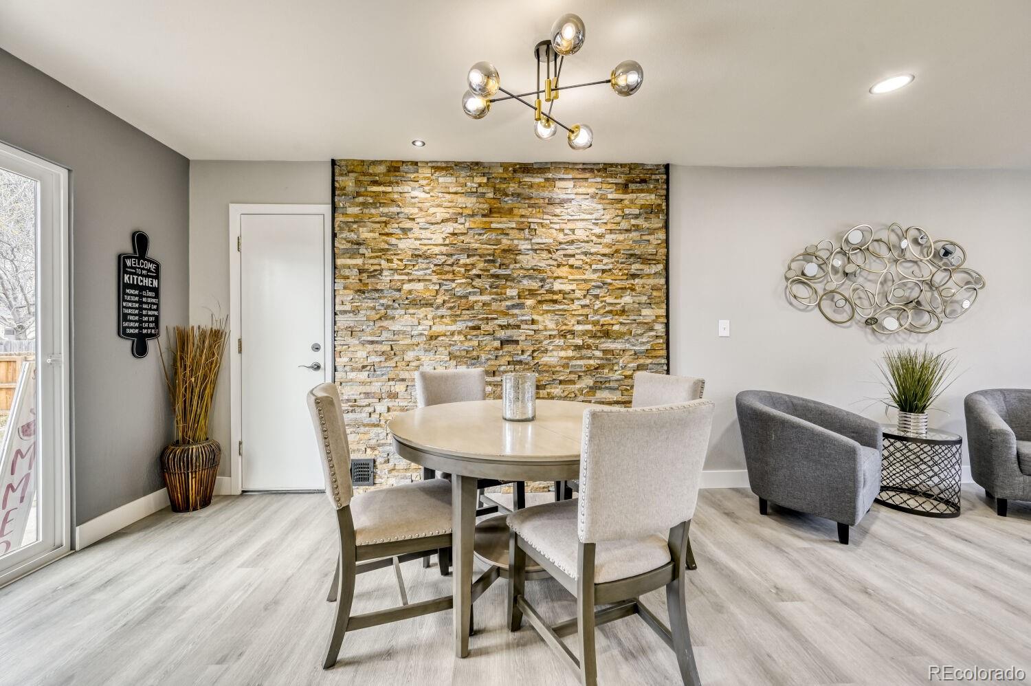 6623 Kipling Street Arvada, CO 80004 - Photo 11 of 39 a view of a dining room with furniture window and outside view