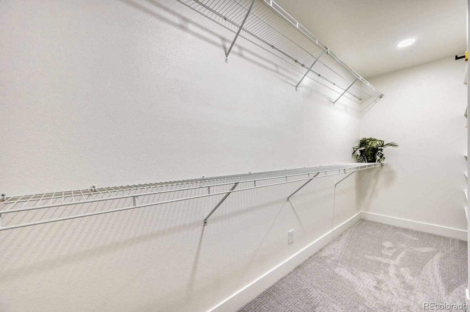 6623 Kipling Street Arvada, CO 80004 - Photo 18 of 39 a view of a room with racks on the wall