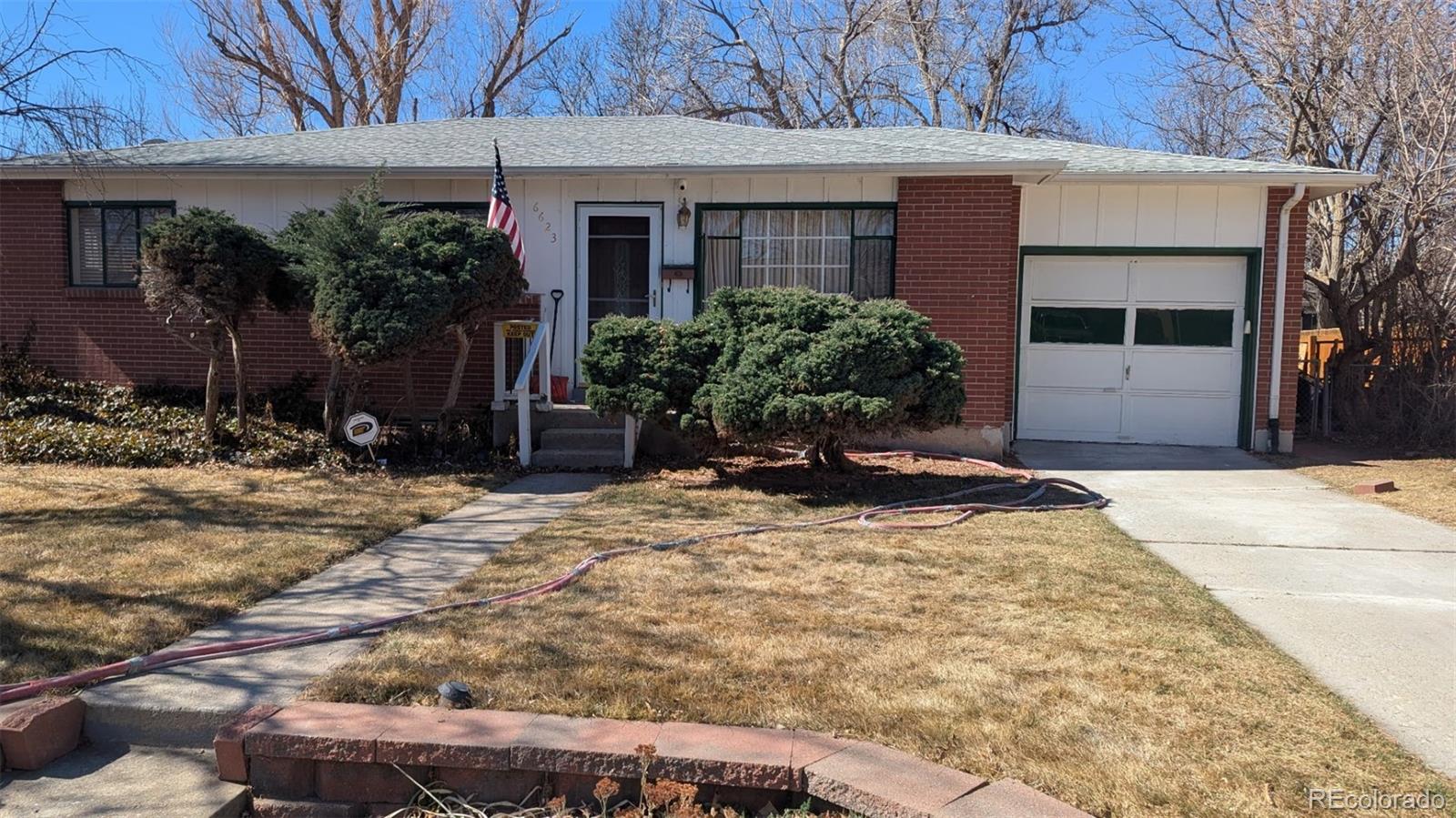 6623 Kipling Street Arvada, CO 80004 - Photo 2 of 39 a view of a house with backyard and sitting area